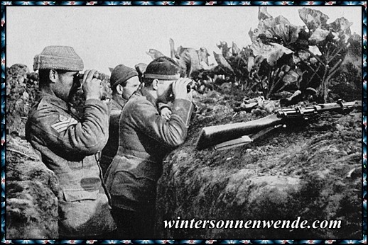 Belgische Soldaten in Deckung beobachten mit Ferngläsern den Feind.